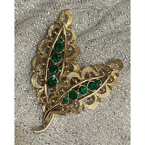 Vintage gold floral brooch with green gems